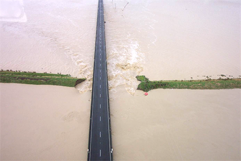 Emergency Management - Fees & Charges - flooded road.