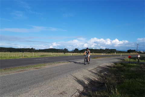 Palmer Rd Pathway & Foxton Beach Loop - Man riding is bike along a sealed track.