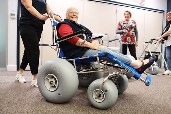 All Terrain Wheelchairs - Daphne Barrett tries out one of the wheelchairs during a Access and Inclusion Forum meeting.